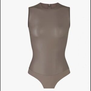 Skims faux leather crewneck bodysuit cement